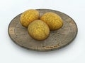 Three golden eggs on stone plate