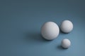 3d render, three white spheres with different sizes on blue background