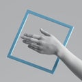 3d render white artificial female hand with blue geometric shape, square frame. Human mannequin body part isolated on plain