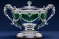 3d rendered antique silver cup adorned with emeralds and rubies on dark blue studio background Royalty Free Stock Photo