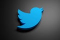 3d rendered blue twitter logo on a shiny black background