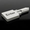 3D Rendered Enter Key Shaped Like a Key on a Dark Reflective Surface keyboard computer Royalty Free Stock Photo