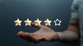 3D rendered five-star rating concept over the male hand Royalty Free Stock Photo