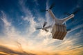 3D rendered illustration of drone flying in the sky and delivering a package at sunset Royalty Free Stock Photo