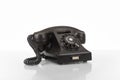 3d rendered illustration of a wired black vintage rotary telephone isolated on a white background