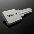 A3D Rendered Key Shaped Enter Button on a Dark Reflective Surface keyboard computer Royalty Free Stock Photo
