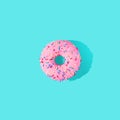 3D rendered pink glazed donut on the bright blue background
