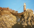 A 3d rendered illustration of a pirate town build on a rocky island.