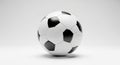 A 3D rendered soccer ball with black and white hexagon pattern isolated on a clean white background from a slightly angled Royalty Free Stock Photo