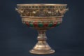 3d rendered vintage silver cup embellished with emeralds and rubies on dark blue studio background Royalty Free Stock Photo