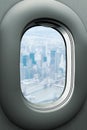 An airplane window looking out the Brooklyn Bridge and Manhattan, New York City