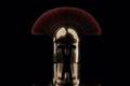 3d rendering of ancient greek Sparta type helmet in low key light