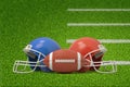 3d rendering of ball for American football in front of two helmets lying on green field. Royalty Free Stock Photo