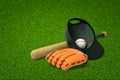 3d rendering of a baseball bat, a cap with a baseball inside, and a baseball glove lying on fresh green lawn. Royalty Free Stock Photo