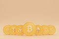 3D rendering of Bitcoin coins in various stacks on gold background.
