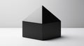 A 3D rendering of a black cube with a triangular base. Royalty Free Stock Photo
