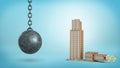 3d rendering of a black iron wrecking ball hanging beside a broken office building with a USD sign on its top.