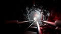 3D rendering Black stone railway tunnel with light at the end Royalty Free Stock Photo