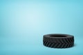 3d rendering of black wheel tyre on blue background