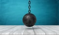 3d rendering of black wrecking ball hanging above wooden surface.