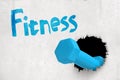 3d rendering of blue dumbbell breaking white wall with `Fitness` sign above