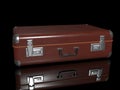 3D - rendering. Brown leather suitcase lies on a black glossy surface