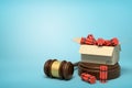 3d rendering of cardboard box full of dynamite standing on sounding block with judge gavel lying beside block on light