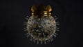 3D rendering of the cavid-19 coronavirus, with a Golden crown on a dark background. Illustration for medical banners, advertising