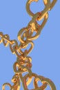 3D rendering of chains of golden hearts