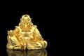 3d rendering. Chinese golden happy smiling monk buddha statue with clipping path isolated on black background Royalty Free Stock Photo