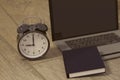 3D rendering of a clock, laptop and book for studies for works