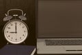 3D rendering of a clock, laptop and book for studies for works