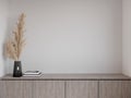 3D rendering close up empty space of low cabinet with white wall Royalty Free Stock Photo