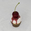 3D rendering Close up Vanilla Cupcake Whipping Cream With Cherry Royalty Free Stock Photo