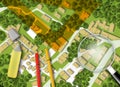 3D rendering of colored work tool over a cadastral map of territory