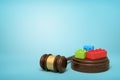 3d rendering of colorful lego pieces on round wooden block and brown wooden gavel on blue background Royalty Free Stock Photo