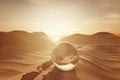 3d rendering of crystal ball on desert landscape with footsteps