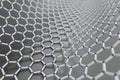 3D rendering of curved graphene sheet on grey metalic surface