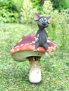 3D rendering of a cartoon mouse sitting on a fairytale mushroom.