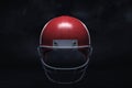 3d rendering of a dark red American football helmet shown on a black background. Royalty Free Stock Photo