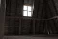 3d rendering of darken attic with bright light at window Royalty Free Stock Photo