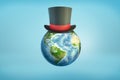 3d rendering of a Earth globe with a black magician`s top hat sitting on its surface like on a head.