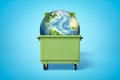 3d rendering of earth globe in green trash bin on blue background Royalty Free Stock Photo