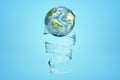 3d rendering of Earth and transparent whirlpool wrapping itself around it like ribbon on blue background.