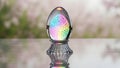 A glass egg sitting on top of a table (ai generated) Royalty Free Stock Photo