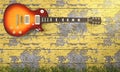 3d rendering electrical guitar near vintage wooden wall with ivy