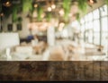 3D Rendering, Empty wooden table top with lights bokeh on blur restaurant background
