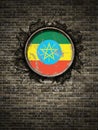 Old Ethiopia flag in brick wall Royalty Free Stock Photo