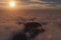 3D rendering from a flight over a cloudy mountain scenery at sunrise Royalty Free Stock Photo