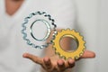 3D rendering of floating gears on a man's hand - engineering concept